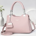 Elegant light pink leather handbag with top handles and adjustable shoulder strap - Purple
