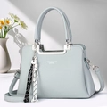 Stylish misty blue lychee texture tote bag with crossbody strap and floral decor - Blue