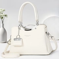 Detailed macro of white litchi pattern leather bag with silver metallic handle - Off-white