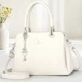 Detail of cream leather handbag with heart pendant and adjustable strap - Off-white