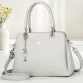Detail of grey pebble leather handbag with silver heart charm and David Jones logo - Gray