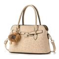 Detail of vintage leopard print handbag featuring gold buckle and plush lion charm - Light Khaki