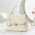 Creamy leather tote bag with silver butterfly clasp and detachable strap for commuting - Off-white