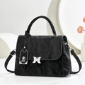 Detail of black wrinkled leather handbag with silver butterfly buckle and FAK charm - Black