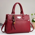 Deep red lychee texture tote bag with silver lock and vintage pendant accessory - Red