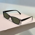 Detail of trendy narrow rectangular sunglasses with transparent grey frames and dark lenses - Transparent Grey Black Frame Light Green Lens