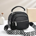 Black pebbled leather handbag with three-layer zippers and geometric woven strap - 21x18x9cm / Black