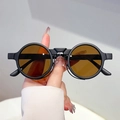 Retro round flip-up sunglasses with matte black frames and amber lenses for a vintage look - Black Frame Tea Lens