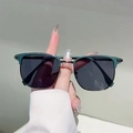 Detailed view of retro semi-rimless sunglasses with dark green frame and silver metal bridge - Green Frame Grey Lens