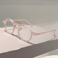 Gafas redondas retro rosa translúcido con puente de metal dorado en base minimalista - Montura rosa con lente transparente