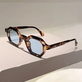 Close-up of tortoise shell geometric sunglasses with light blue lenses and silver rivets - Leopard Frame Light Blue Lens