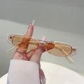 Gafas de sol ovaladas vintage con montura transparente y modernos lentes naranjas - Montura Champaña Transparente Lente Champaña