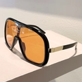 Occhiali da sole oversize con montatura nera e lenti arancioni, vista laterale - Montatura Nera Lenti Arancioni