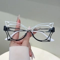 Occhiali cat-eye con montatura a farfalla traforata e design a contrasto bianco e nero - Montatura bicolore bianco e nero lenti trasparenti