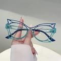 Handheld view of dual-tone hollow cat-eye glasses frames in navy blue and teal - Blue and Green Bicolor Frame Clear Lens