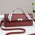 Burgundy faux leather handbag with silk scarf handle and golden twist lock closure - Red