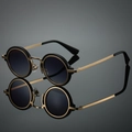 Retro round sunglasses with thick black frames and gold metal temples on a reflective surface - Inner Gold Outer Black Frame Gradient Grey Lens