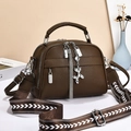 Dark brown pebble leather crossbody handbag with wide patterned strap and tassel detail - Coffee