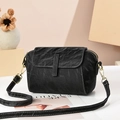 Elegant black shell crossbody bag with contrast stitching and golden hardware - Black