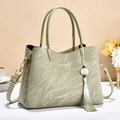 Elegant light green soft leather handbag with floral tassel and golden fashion lettering - Green