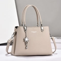 Beige faux leather crossbody tote bag with floral pendant and large capacity - Light Khaki