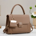Brown faux leather crossbody handbag with woven flap and mini bag charm accessory - Brown