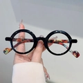 Gafas redondas retro en negro brillante con varillas en patrón de carey vibrante - Montura Negra Lente Transparente