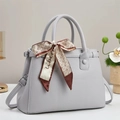 Detail of light gray lychee grain leather handbag with decorative geometric silk scarf - 30x21x12cm / Gray