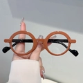 Montura de gafas redondas retro en naranja-marrón brillante con patillas negras finas - Montura Naranja Lentes Transparentes