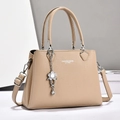 Beige faux leather handbag with litchi texture, dual handles and a floral charm - Dark Khaki