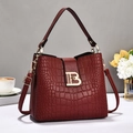 Detail of burgundy crocodile pattern handbag with gold B letter metal buckle closure - Wine Red