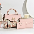 Pink three-piece handbag set with floral prints and swan clasp on golden metal handles - Pink