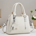 Detail of white lychee pattern leather tote bag with star charm and silver hardware - Off White