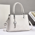 Elegant ivory white tote bag with dual handles and flower pendant for professional women - Off White