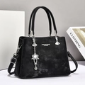 Black vintage leather tote bag with silver flower charm and large shoulder capacity - Black