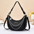 Fashionable black crescent saddle bag with metal chain detail and pebble leather texture - Black