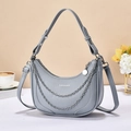 Close-up of grey hobo bag showing lychee grain texture and silver metal chain detail - Blue