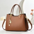 Brown lychee texture leather handbag with gold pearl pendant charm and shoulder strap - Khaki/Earth Yellow