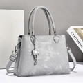 Minimalist grey handbag for women with pearl-finish texture and flower charm - Gray