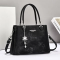 Minimalist black PU leather shoulder bag with vintage texture and floral pendant charm - Black
