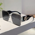 Detail of square sunglasses with metal trim and circular S logo on thick black temples - Gunmetal Frame Black Grey Lens