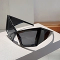 Futuristic black geometric hip-hop sunglasses with sharp triangular frame on white stand - Black Frame Grey Lens