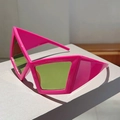 Detail of hot pink geometric futuristic sunglasses with bold green tinted lenses - Red Frame Green Lens