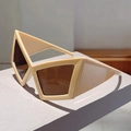 Detail of cream geometric cat-eye sunglasses with thick frames and dark brown lenses - Khaki Frame Tea Lenses