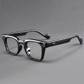 Macro detail of glossy black square frame glasses with silver rivet embellishments - Black Frame Clear Lens