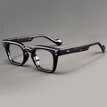 Detail of vintage square glasses frame featuring silver rivets and tortoiseshell temples - Black Frame Clear Lens Tortoise Legs