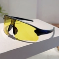 Detail of yellow cycling sunglasses with black streamlined frame on a white display pedestal - Black Frame Yellow Lens