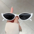 Fashionable cat-eye sunglasses with white glossy frame and black lenses held by hand - White Frame Dark Grey Lens