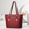 Deep red leather tote bag with gold hardware and top handle for elegant commute use - Wine Red