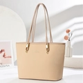 Close-up of woven texture and metal ring detail on elegant beige large tote bag - Light Khaki